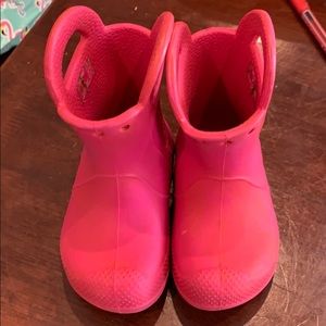 Pink croc rain boots...
